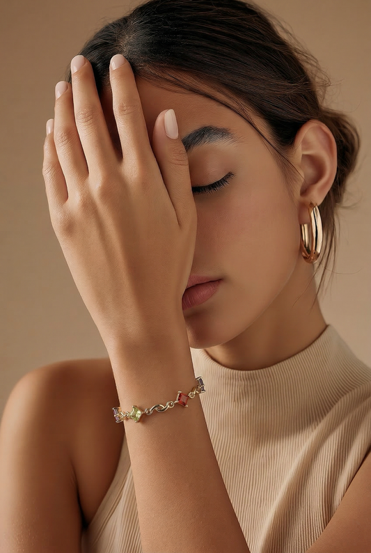 Gold-plated bracelet with colorful squares.